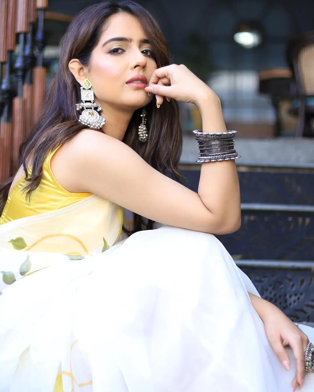 Malvi Malhotra Stills in White Saree Yellow Sleeveless Blouse